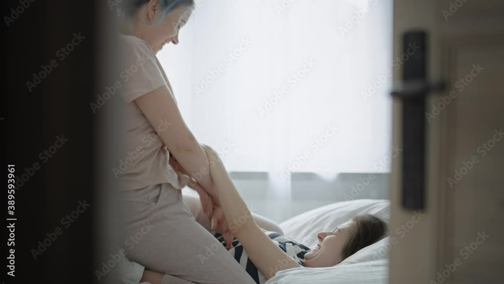 Video of lesbian couple goofing around in the bedroom. Shot with RED helium camera in 8K Video of lesbian couple goofing around in the bedroom. Shot with RED helium camera in 8K