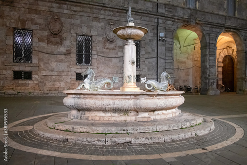 Night view of the Renaissance and medieval squares of Ascoli Piceno, Italy.