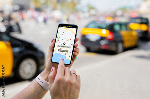 Person using ride sharing app on mobile phone