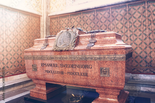 Tomb with remains of Emanuel Swedenborg in Uppsala Cathedral. The tomb of red granite. Massive stone grave with remains photo