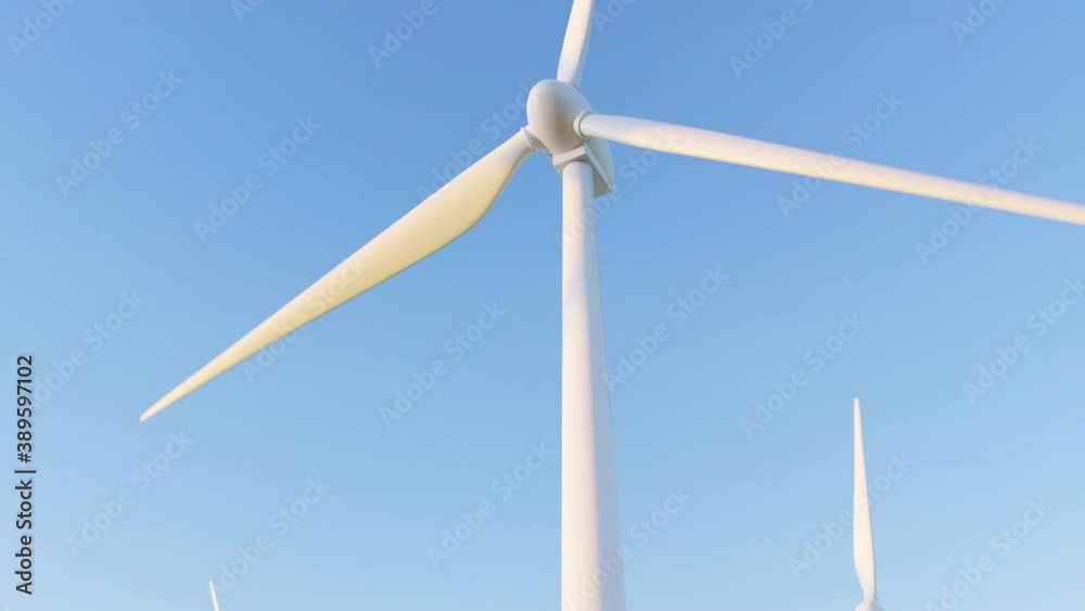 Wind power plant at sunset under clear blue sky in field. Video with Renewable Green energy from Wind farm generators. Creative, beautiful footage in 4K with Towers and Turbines with copy spaces. Wind power plant at sunset under clear blue sky in field. Video with Renewable Green energy from Wind farm generators. Creative, beautiful footage in 4K with Towers and Turbines with copy spaces.