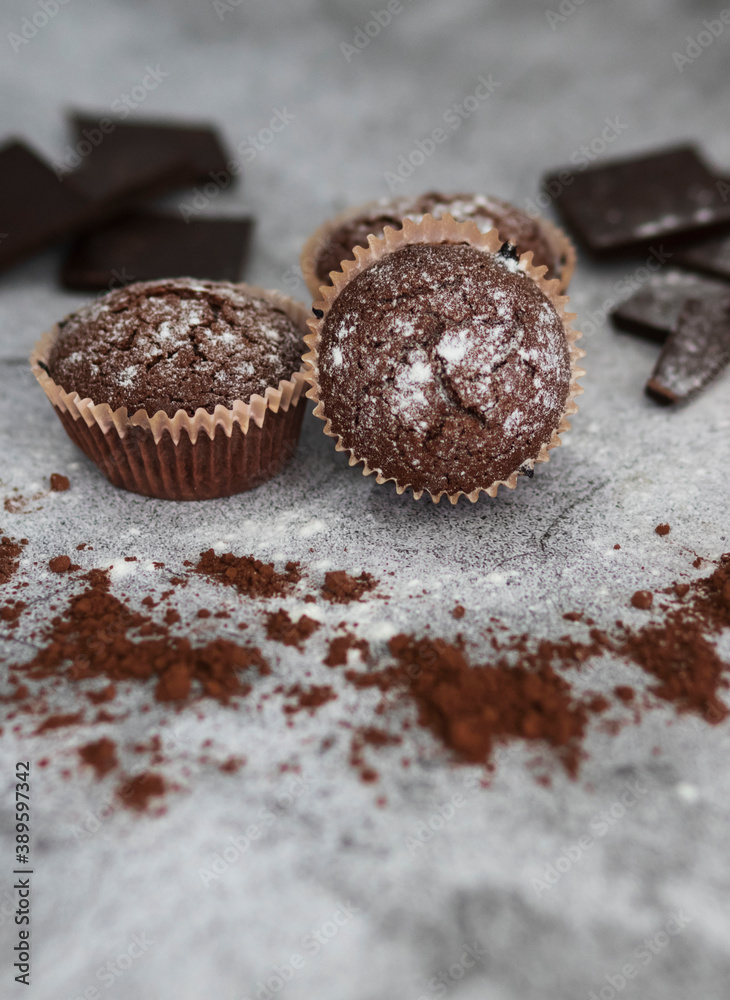 
Chocolate muffins with powdered sugar