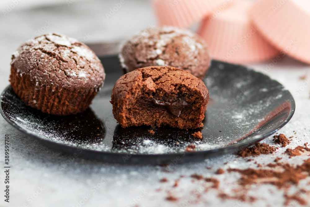 Chocolate muffins with powdered sugar
Chocolate muffins with powdered sugar