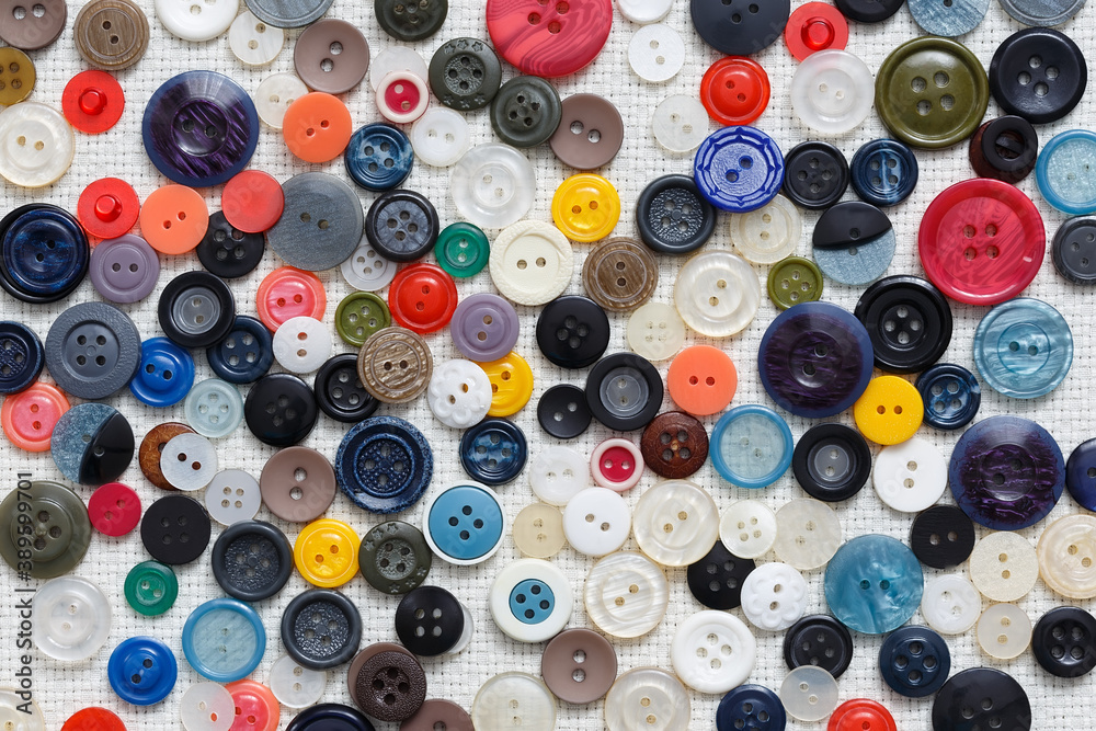 Abstract background of buttons on white woven background