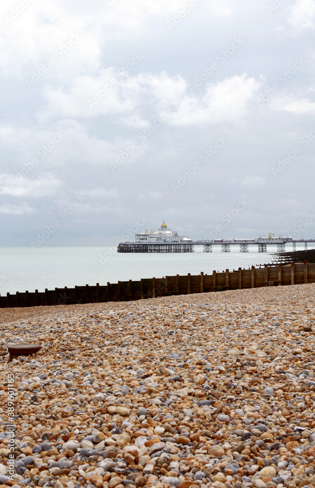 Eastbourne pleasure pier above a calm sea on the East Sussex coast