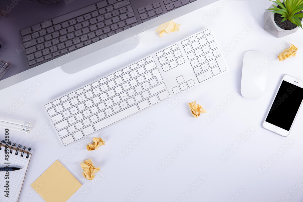 new modern keyboard with screen and computer mouse with smartphone and clumps of paper isolated on white background, close view . High quality photo new modern keyboard with screen and computer mouse with smartphone and clumps of paper isolated on white background, close view . High quality photo
