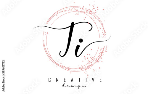 Handwritten TI T I letter logo with sparkling circles with pink glitter.