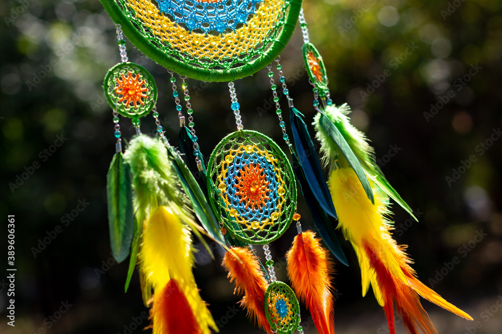 Obraz premium Handmade dream catcher with feathers threads and beads rope hanging