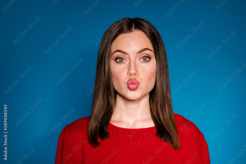 Fototapeta premium Close-up portrait of her she nice attractive charming pretty lovable lovely amorous brown-haired girl sending air kiss isolated bright vivid shine vibrant blue color background