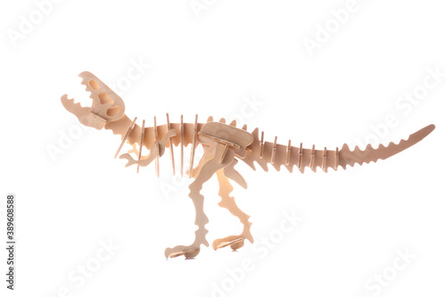 Wooden dinosaur toy isolated on white backgrond.