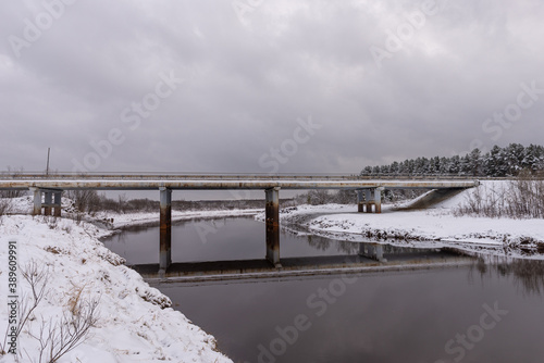 Automobile bridge over a small river. Winter landscape © Niko
