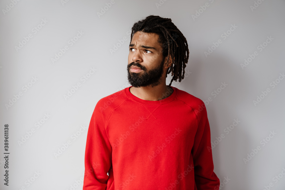 Serious african american man posing and looking aside Serious african american man posing and looking aside