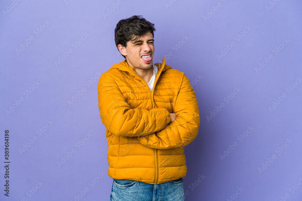 Young cool man funny and friendly sticking out tongue. Young cool man funny and friendly sticking out tongue.