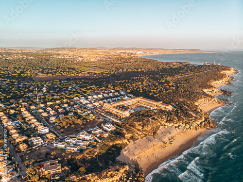 Calas de Roche in Conil in Cadiz Spain from above shot with a drone at sunset
