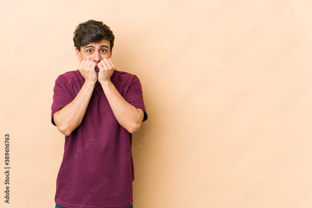 Young cool man biting fingernails, nervous and very anxious. Young cool man biting fingernails, nervous and very anxious.