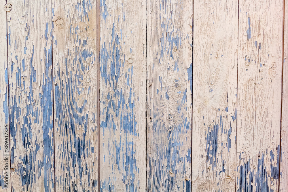Cracked old paint on a wooden wall. Texture background