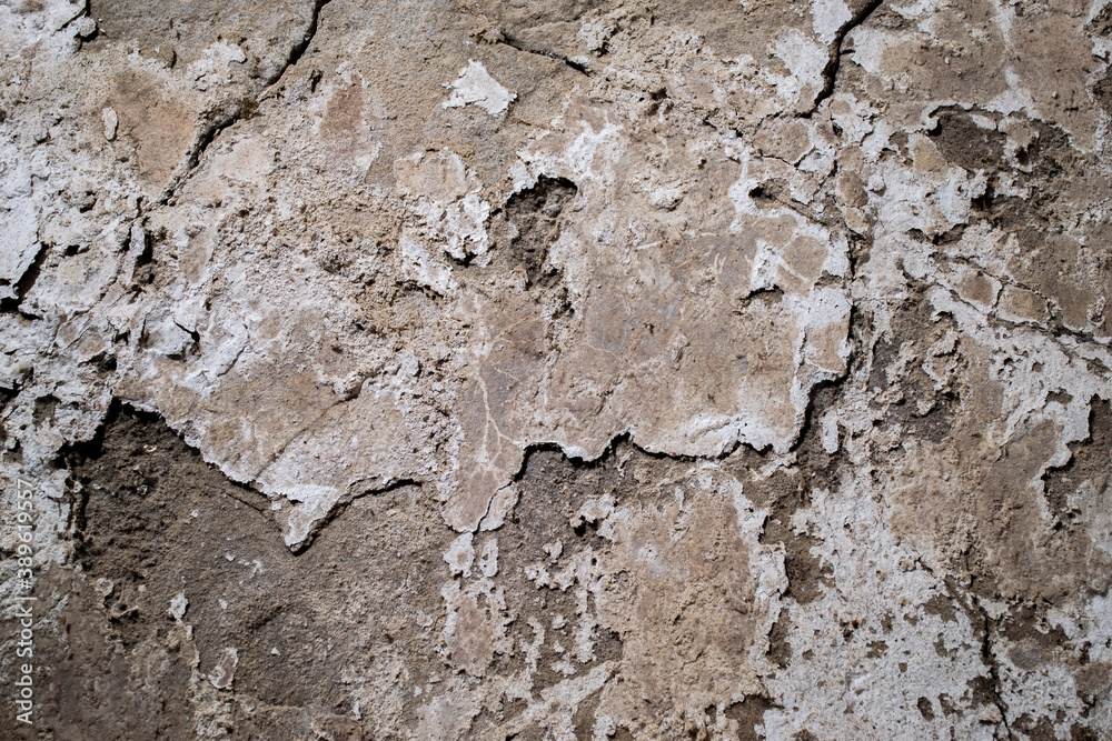 Texture of an old concrete wall, with potholes Texture of an old concrete wall, with potholes