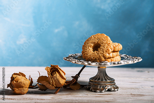 italian canestrelli with fine sugar  over vintage cake stand