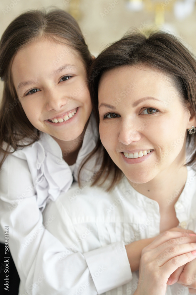Beautiful young mother and cute little daughter posing Beautiful young mother and cute little daughter posing