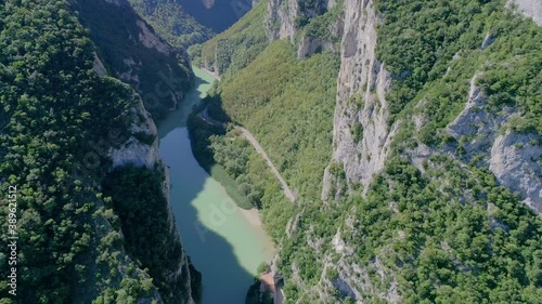 Drone view of the furlo pass, the fascinating canyon of the marche region (Italy). Between the massive walls of the mountains Pietralata and Paganuccio, and and the water of the river Candigliano photo