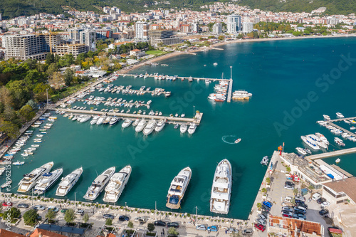 Aerial shot of the marina of a small Adriatic town, aerial view of yachts and boats in marina. Budva, Adriatic sea, Montenegro