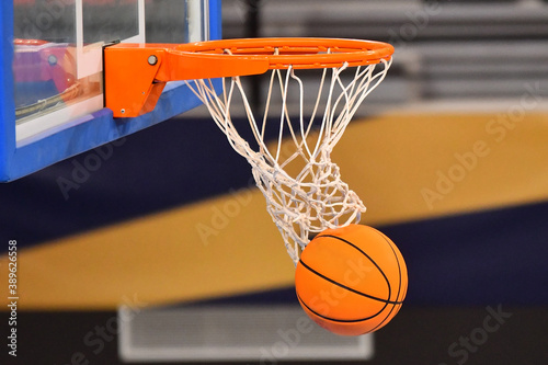 Ball falling through a Basketball Hoop © Filip