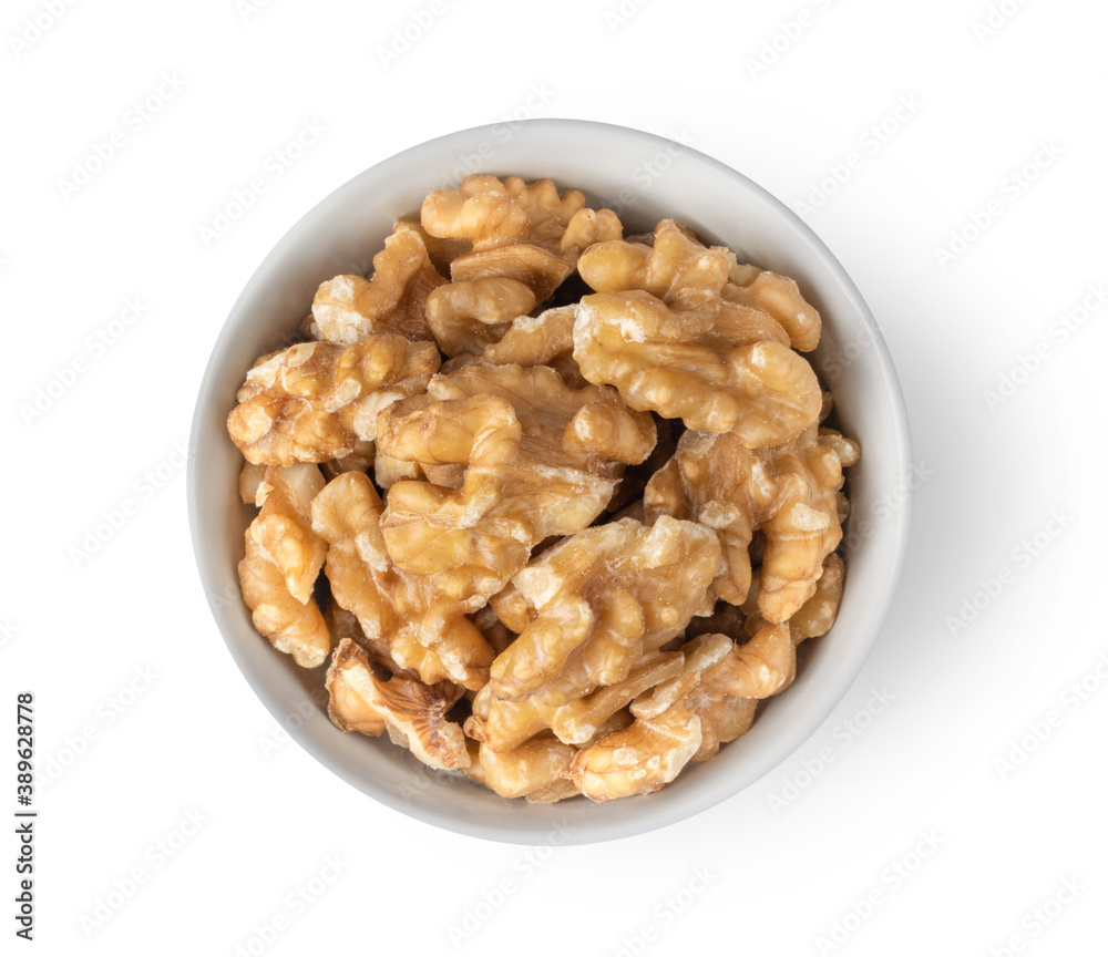 Walnuts in white bowl isolated on white background Walnuts in white bowl isolated on white background