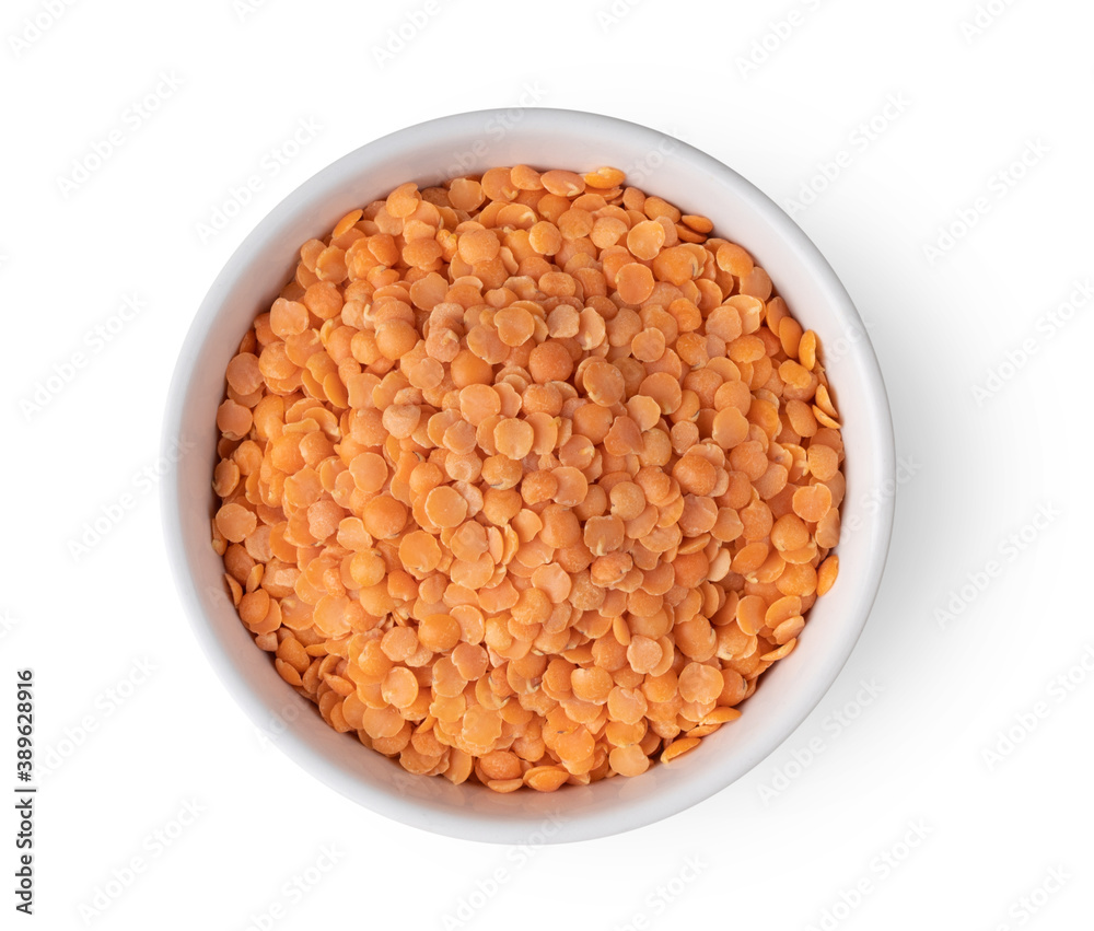 Red lentils in white bowl isolated on white background Red lentils in white bowl isolated on white background