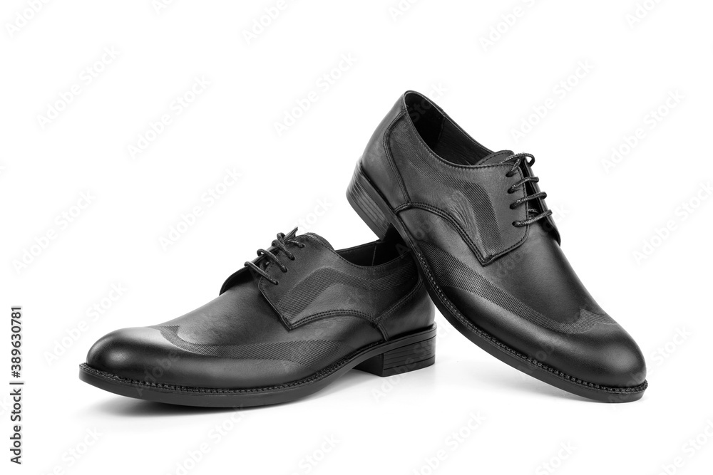 A pair of classic black men's shoes on a white background A pair of classic black men's shoes on a white background
