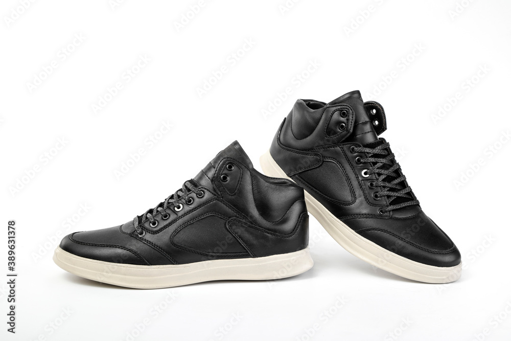 A pair of men's black shoes on white background