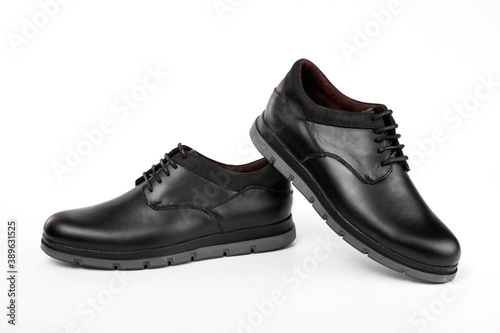Classic black leather shoes on a white background