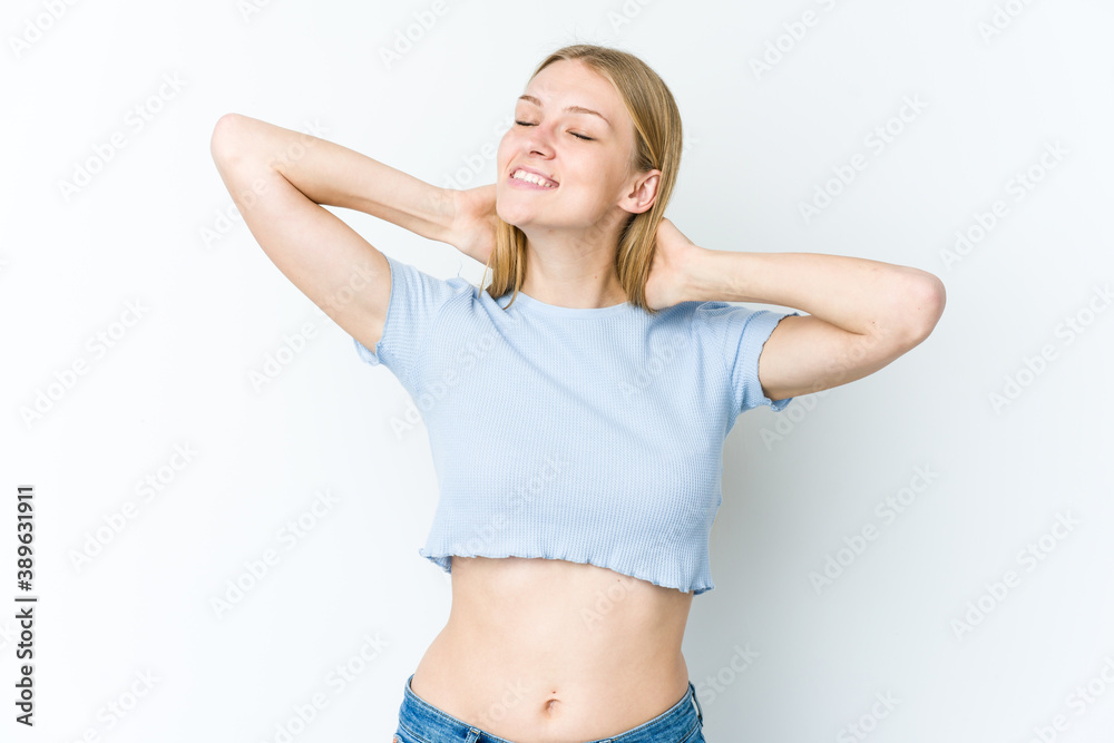 Young blonde woman isolated on white background feeling confident, with hands behind the head. Young blonde woman isolated on white background feeling confident, with hands behind the head.