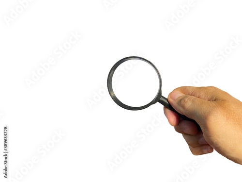 Hand holding Magnifying glass on white backgroun. Business Concept