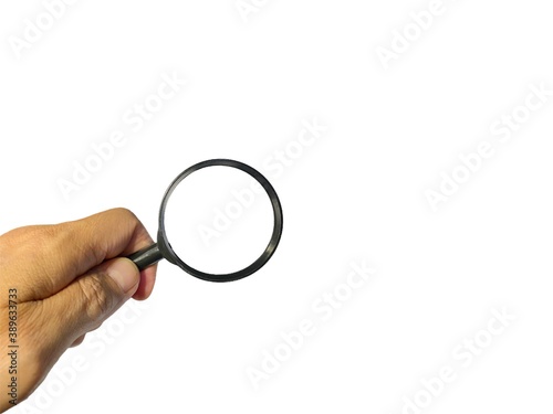 Hand holding Magnifying glass on white backgroun. Business Concept