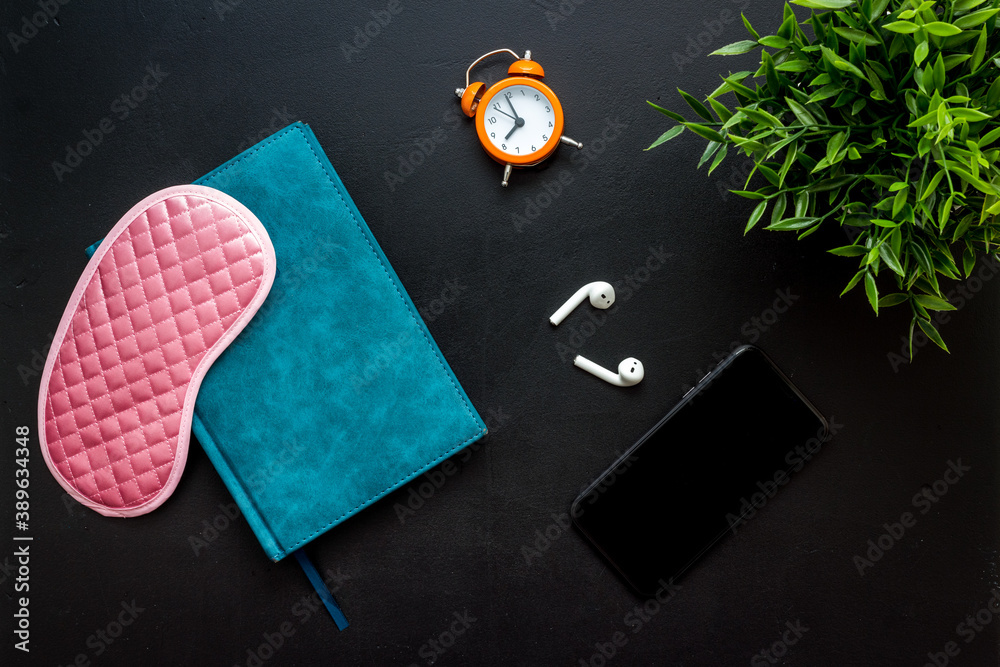 Obraz premium Reading book before going to bed. Sleeping accessories on the table, top view