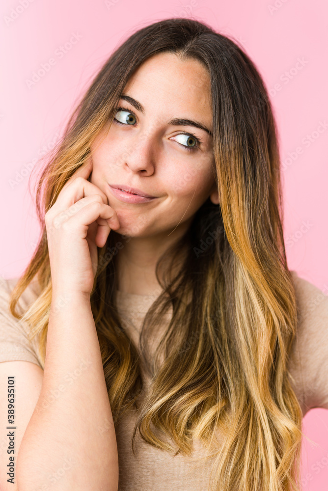Young beautiful woman isolated on pink background Young beautiful woman isolated on pink background