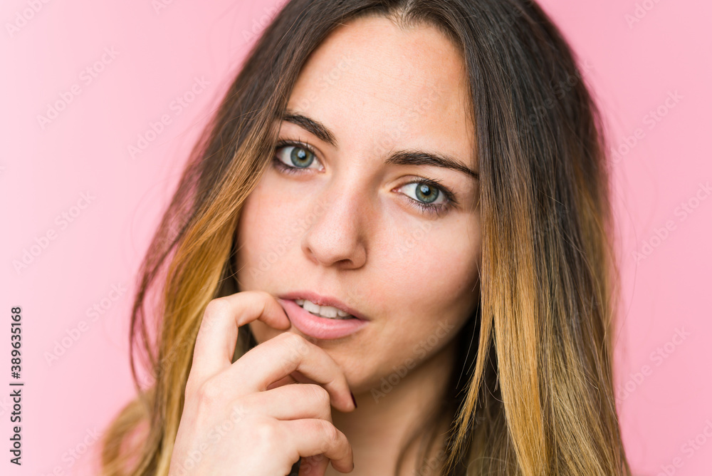 Young beautiful woman isolated on pink background Young beautiful woman isolated on pink background