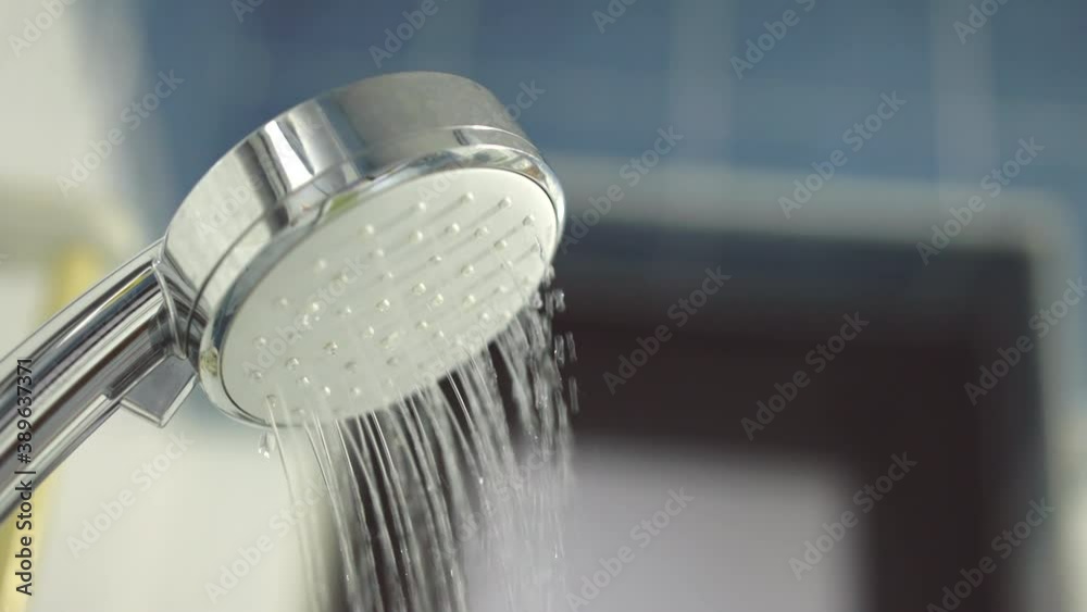 Slow motion shower head and faucet fresh water running in bathroom Slow motion shower head and faucet fresh water running in bathroom