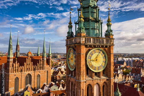 Beautiful clock of the town hall in Gdansk at sunrise, Poland photo