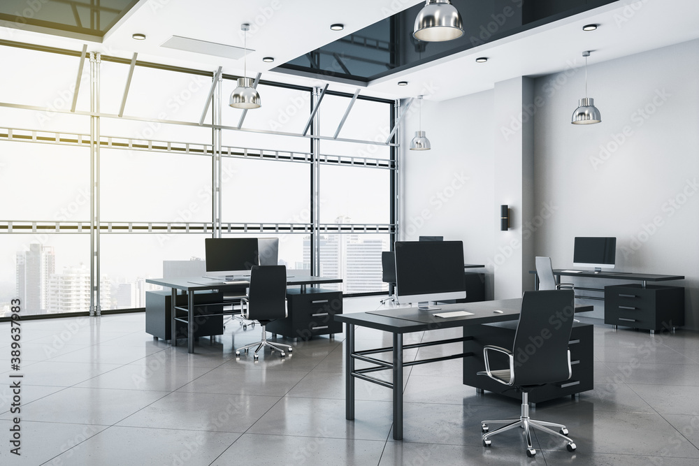 Coworking office interior with blank computers screen. Coworking office interior with blank computers screen.