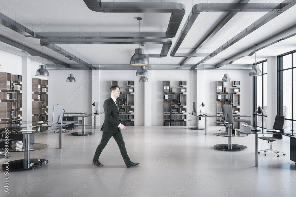 Businessman walking in contemporary office room