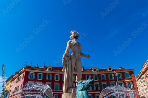 Nice, France - June 18, 2020: Fontaine du Soleil decorated with a mask with the inscription "Protegeons nous" ("Let's protect ourselves")