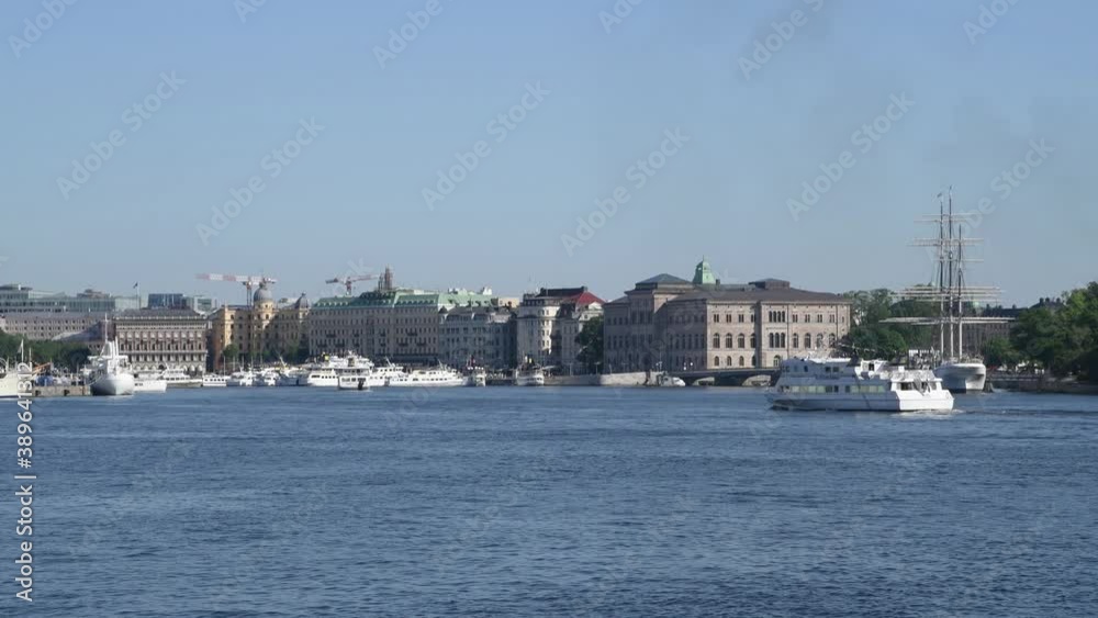 Commuting steamboats and motor boats arriving and leaving Stockholm inner harbor for the archipelago a sunny midsummer day Commuting steamboats and motor boats arriving and leaving Stockholm inner harbor for the archipelago a sunny midsummer day