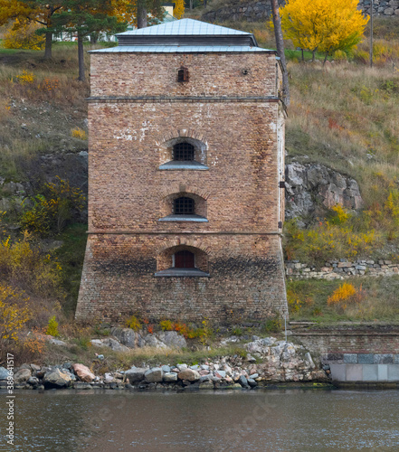 Photography Old watch tower on a quay at the passage Oxdjupet in the Stockholm archipelago