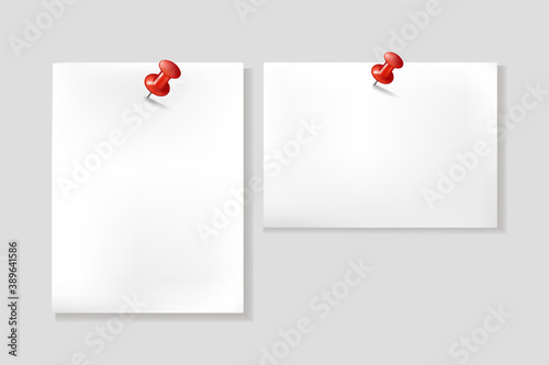 Close up of white note papers, notes on red push pins.