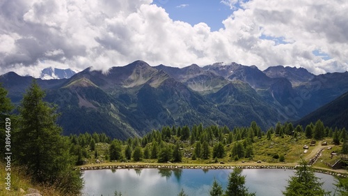 A lake in the Italian Alps with a forest and mountains in background  Trentino  Italy  Europe 