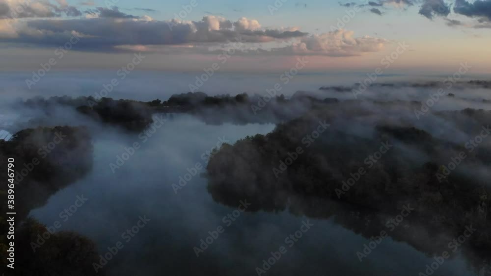 Sunrise overlooking forest and lake Sunrise overlooking forest and lake