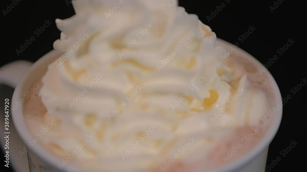 Milk hot chocolate with whipped cream. Cup of hot drink closeup. 4K hand held Milk hot chocolate with whipped cream. Cup of hot drink closeup. 4K hand held