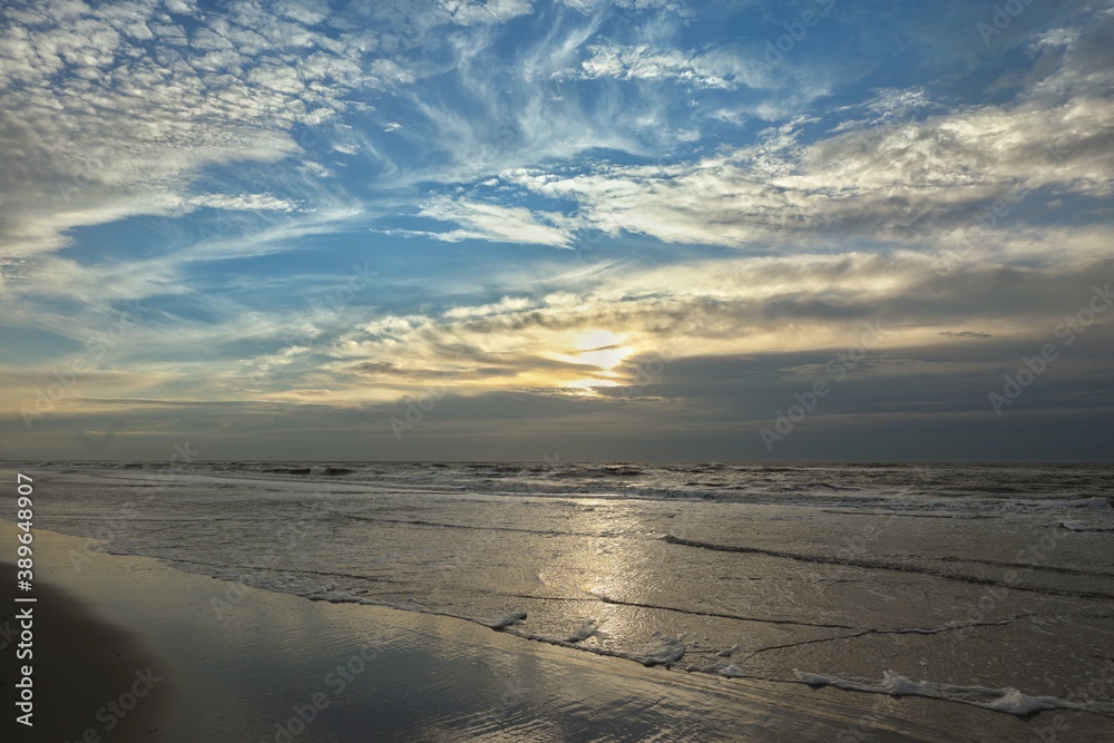 North sea coast. Julianadorp. Netherlands. Sunset, beach and waves.