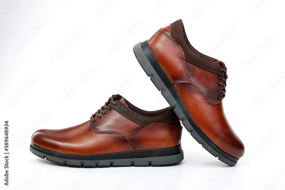 Classic brown leather shoes on a white background